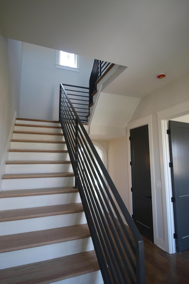 stairway featuring wood finished floors