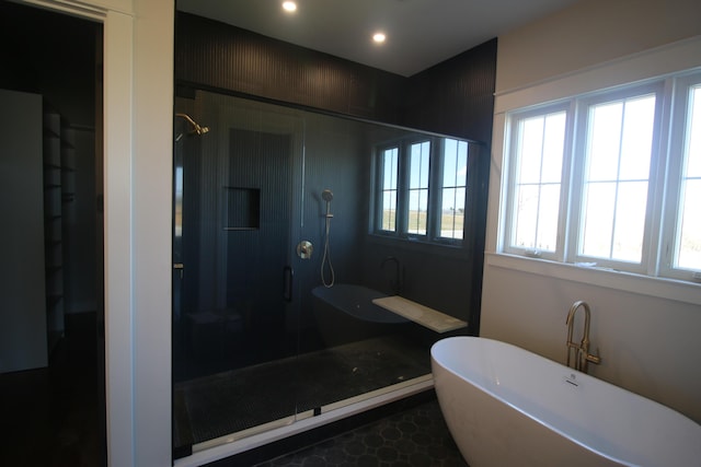 full bath with a soaking tub, a stall shower, and recessed lighting