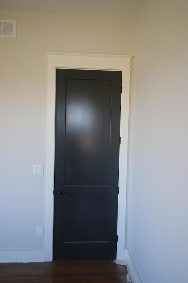 interior space with baseboards and visible vents