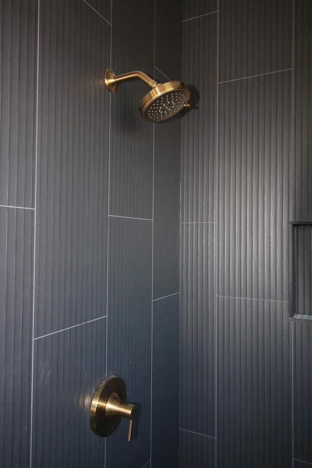 details with a tile shower