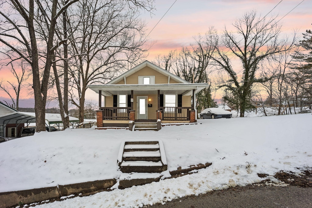 bungalow-style home with a porch