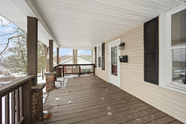 view of snow covered deck