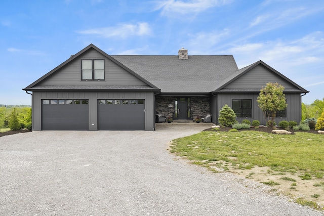 view of front facade featuring a front yard and a garage