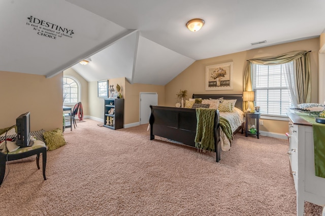 bedroom featuring lofted ceiling and carpet flooring