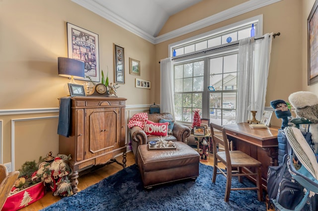 sitting room featuring dark hardwood / wood-style floors, ornamental molding, and vaulted ceiling