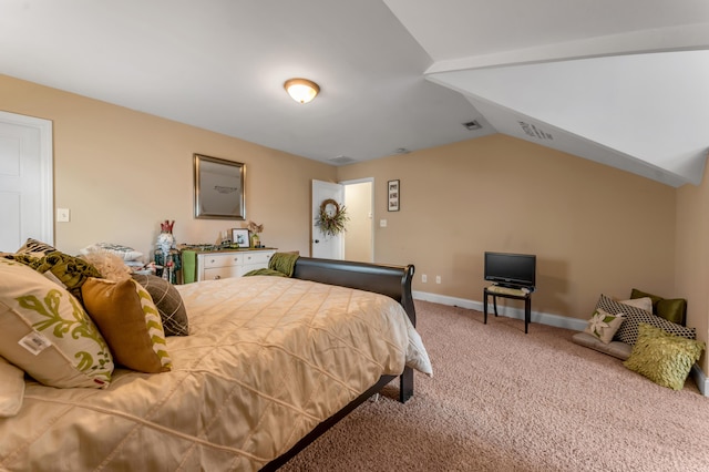 bedroom featuring carpet and lofted ceiling