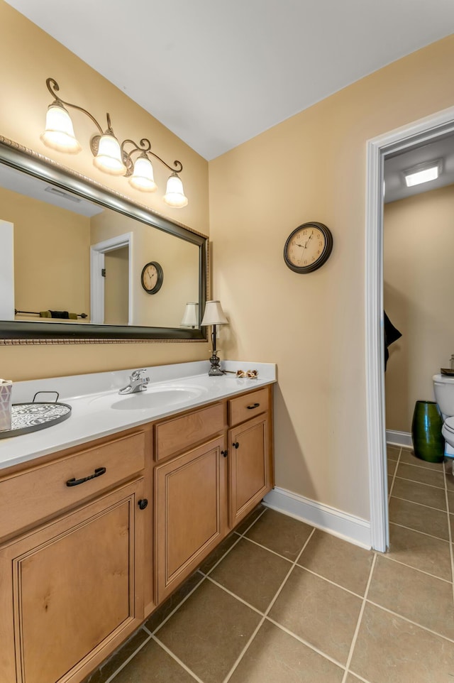 bathroom with vanity and tile patterned flooring