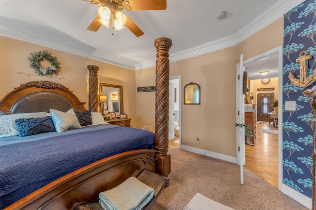 carpeted bedroom with ceiling fan and ornamental molding