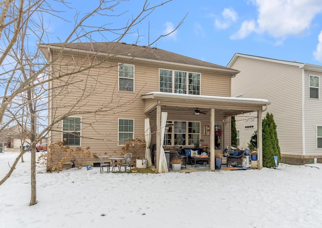 snow covered house with ceiling fan