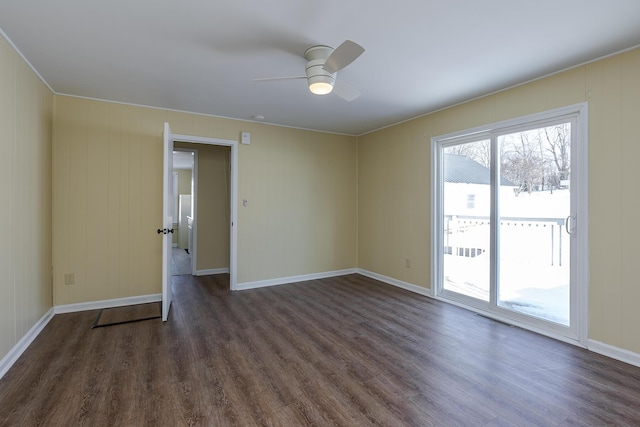 unfurnished room featuring ceiling fan and dark hardwood / wood-style floors