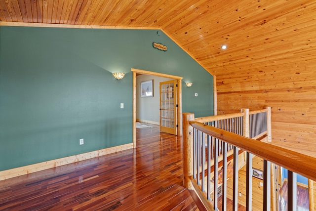 hallway with lofted ceiling, hardwood / wood-style flooring, and wood ceiling