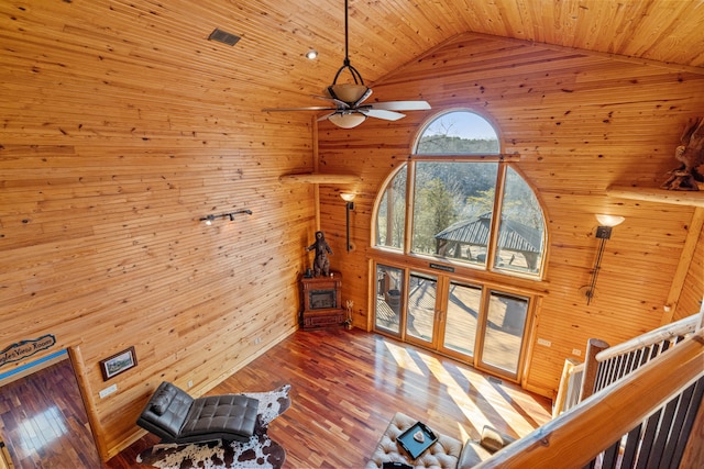 living room with high vaulted ceiling, wooden ceiling, hardwood / wood-style floors, and ceiling fan