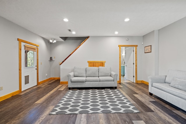 living room featuring dark wood-type flooring