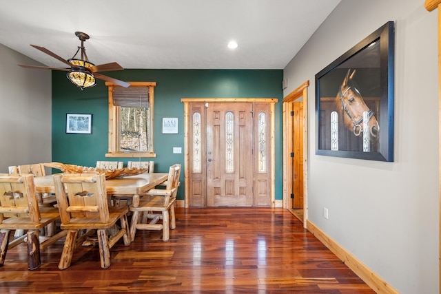 dining room with ceiling fan and dark hardwood / wood-style flooring