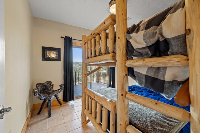 bedroom featuring light tile patterned floors