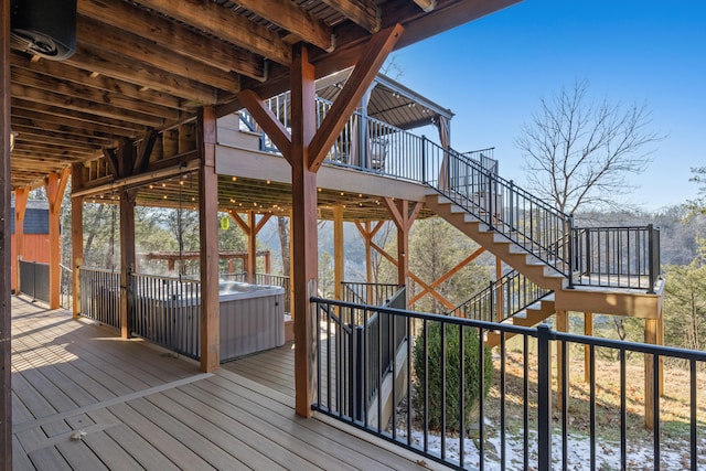 deck featuring a hot tub