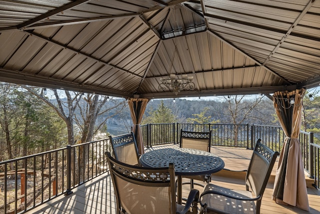 wooden terrace featuring a gazebo