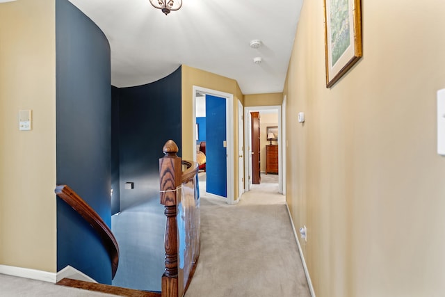 hallway featuring light carpet