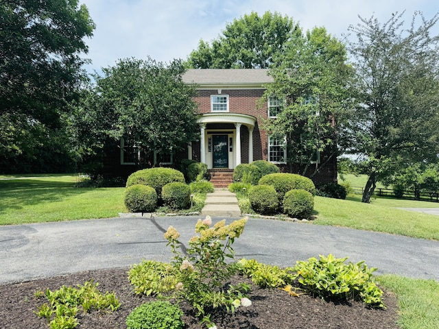 view of front of home with a front lawn