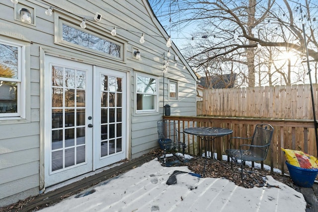 wooden deck featuring french doors