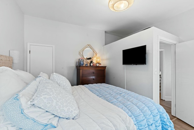 bedroom with hardwood / wood-style flooring