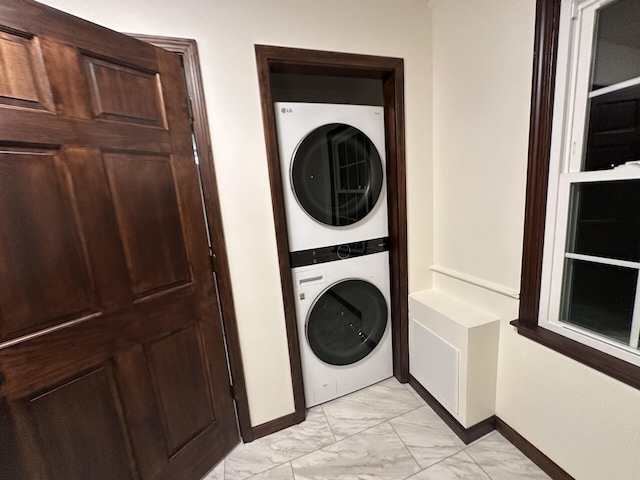 laundry area featuring stacked washer and dryer