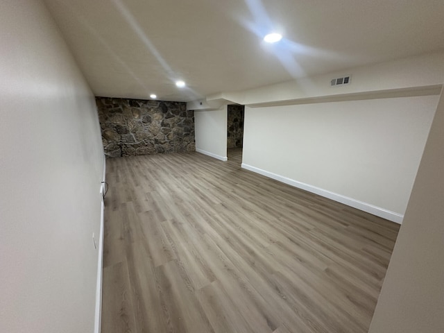 basement featuring light hardwood / wood-style floors