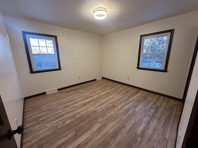 empty room featuring hardwood / wood-style floors