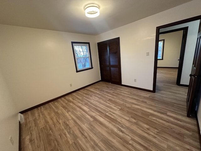 unfurnished bedroom featuring wood-type flooring