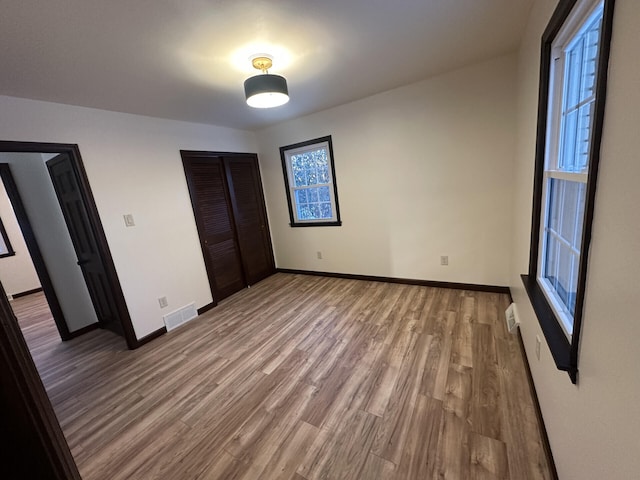 unfurnished bedroom featuring hardwood / wood-style floors