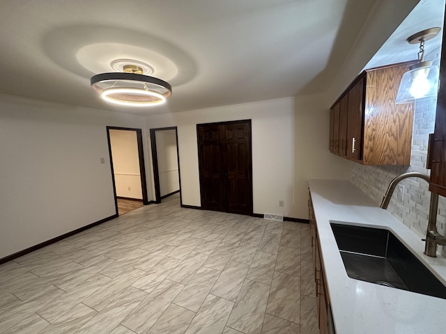 kitchen with sink and backsplash