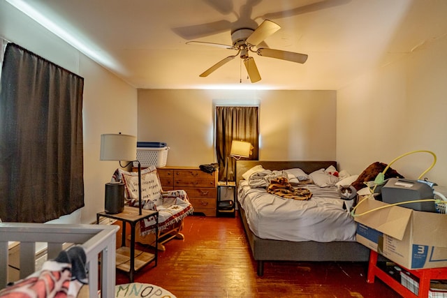 bedroom with ceiling fan and dark hardwood / wood-style floors