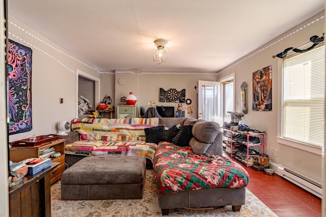 living room featuring wood-type flooring, crown molding, and a baseboard heating unit