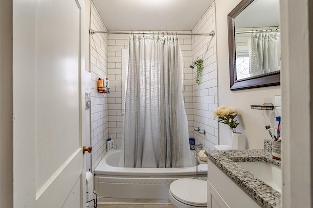 full bathroom featuring shower / tub combo, vanity, and toilet