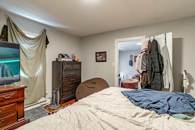 bedroom featuring a baseboard heating unit