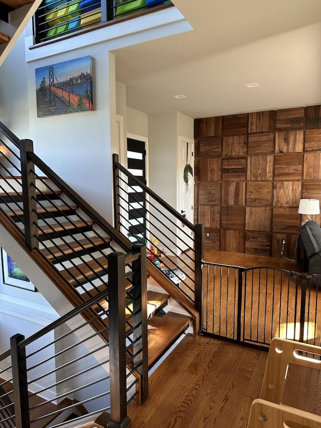 staircase featuring hardwood / wood-style flooring