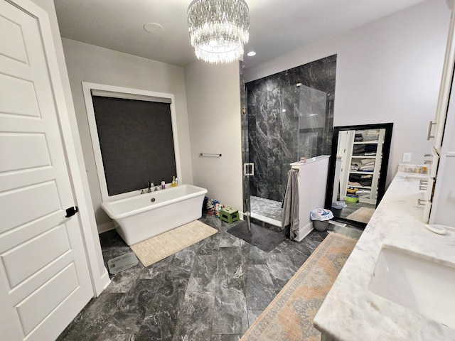 bathroom with vanity, separate shower and tub, and a notable chandelier