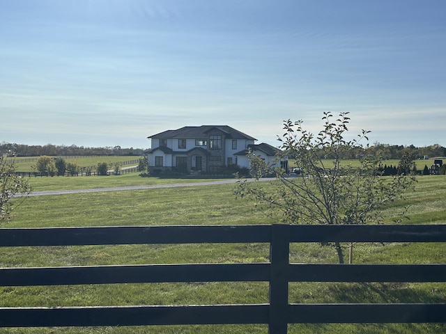 view of yard with a rural view