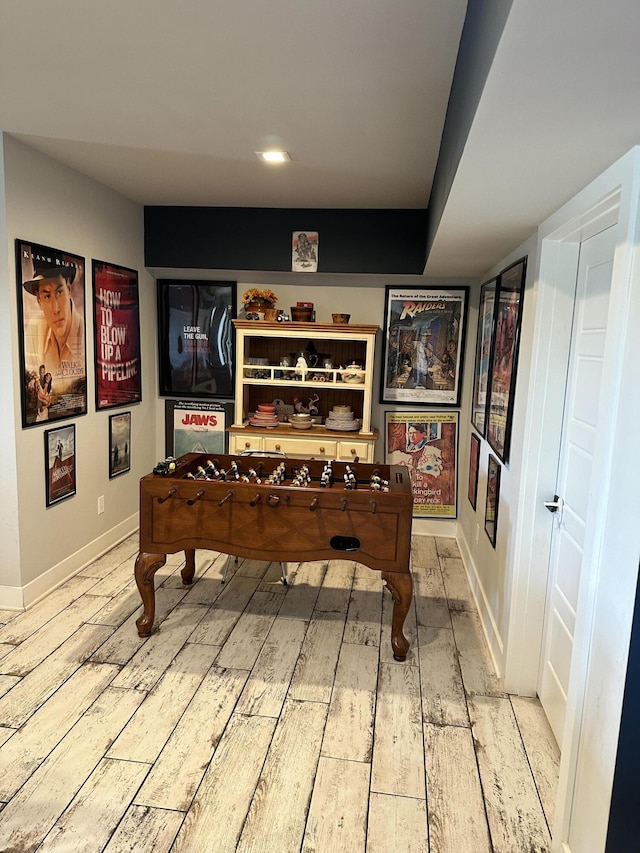 recreation room featuring hardwood / wood-style floors