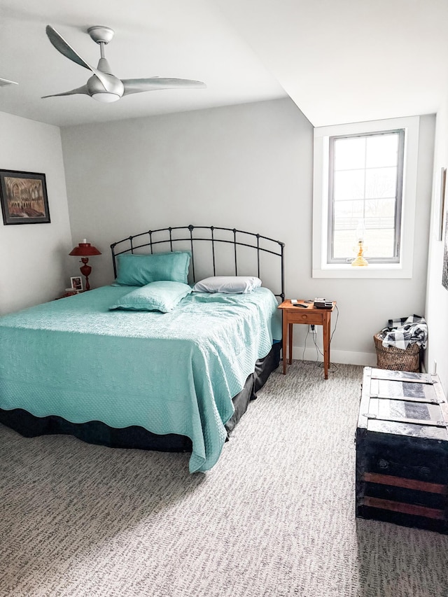 bedroom with ceiling fan and carpet