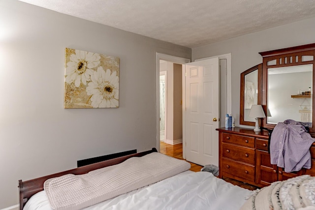 bedroom featuring a textured ceiling