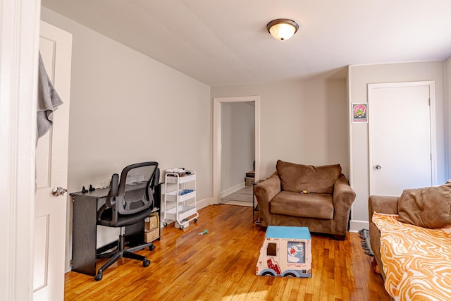 office space with wood-type flooring