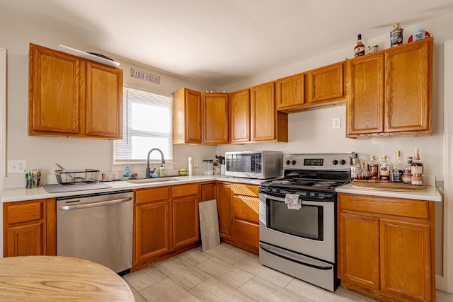 kitchen with appliances with stainless steel finishes and sink