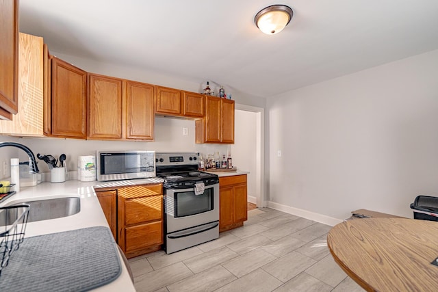 kitchen featuring stainless steel appliances and sink