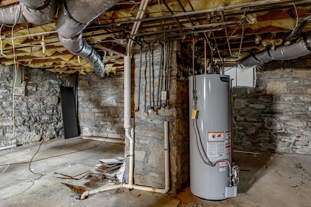 utility room featuring gas water heater