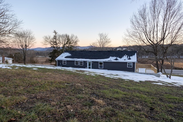 ranch-style house featuring a lawn