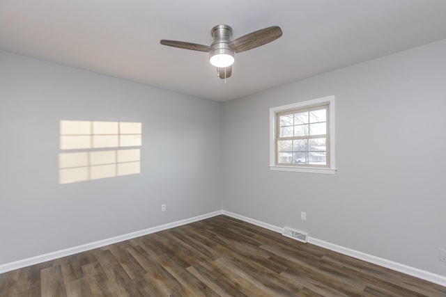 unfurnished room featuring ceiling fan and dark hardwood / wood-style floors