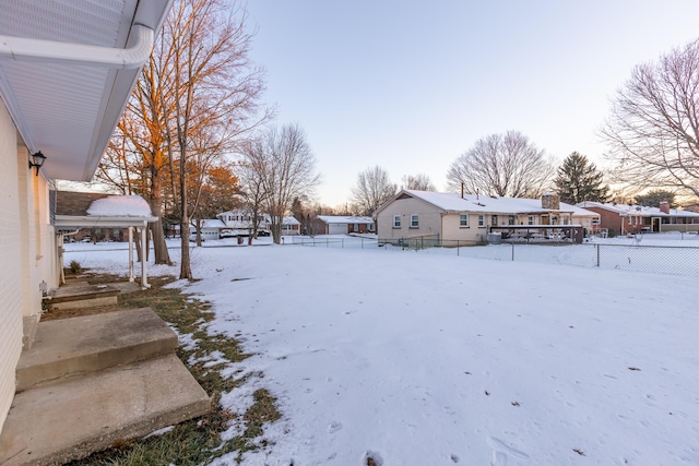 view of yard layered in snow