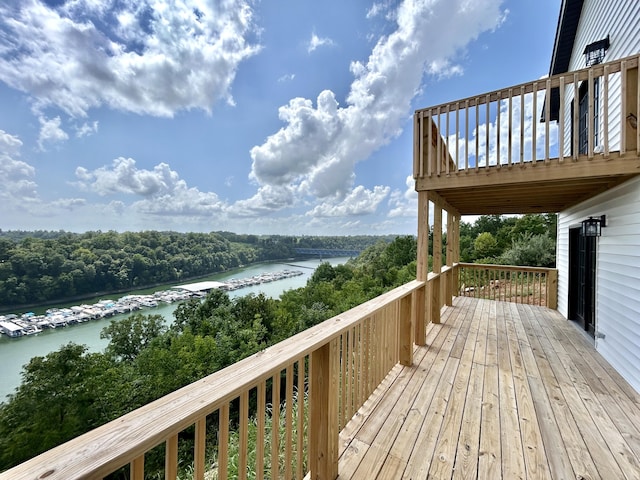 wooden terrace with a water view