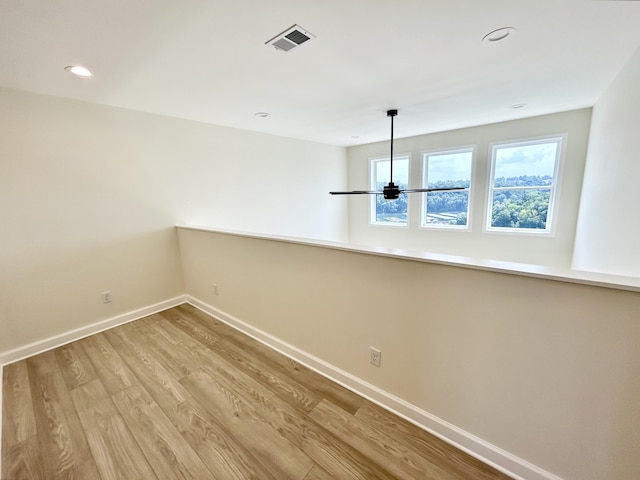 spare room with light hardwood / wood-style floors